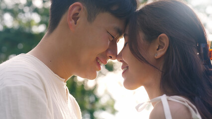 Young adult asia people fiance happy lover flirt fall in love nose kiss hug cuddle care trust....