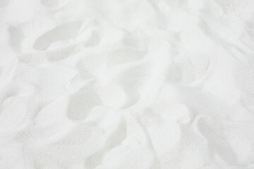 Selective focus.Top of white sand background.for material summer design ideas