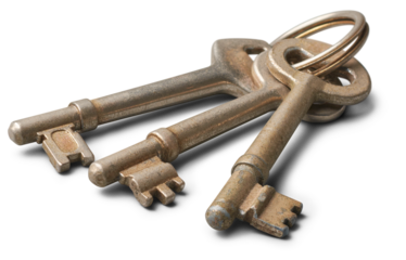 bunch of old door keys, three used metallic silver house keys isolated on white background, selective focus with copy space