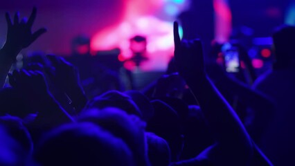 People having fun at a concert or music festival 4K, waving their hands, event entertainment, audience excitement, live performance atmosphere, concert, music festival, crowd, party. - Powered by Adobe