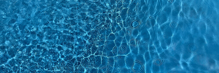 Tranquil blue water surface with gentle ripples, useful as a serene background or for themes related to water, nature, or calmness - obrazy, fototapety, plakaty