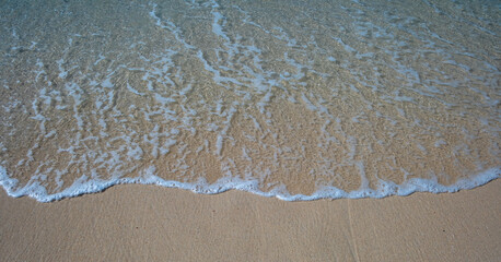 Gentle waves lap against a tropical beach in Philippines