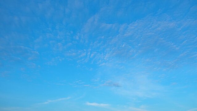 Blue sky time lapse, In a whirlwind of moments, the blue sky metamorphoses, its canvas adorned with fast-moving clouds, creating a visual spectacle in timelapse. 
