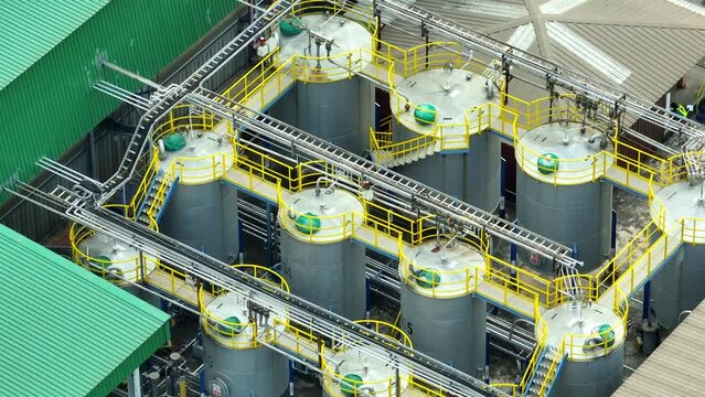 A lubricant plant is a facility that manufactures lubricating oils and greases. It blends and packages various lubricants for industrial and automotive applications. Technology and fluid concept. 4K.
