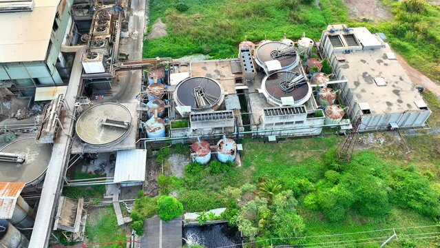 Step outside the paper and packaging factory, and you'll witness a manufacturing marvel in progress, as complex machinery churns out packaging materials with precision and efficiency. Aerial view.