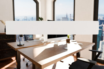 Fototapeta na wymiar transparent text box in front of modern minimalistic pc workspace in luxurious loft office and panoramic view; remote work home office concept; bright daylight; 3D rendering