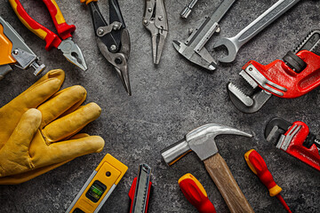 Construction Tools On Dark Background Composed Arround Of Centre Of Image.