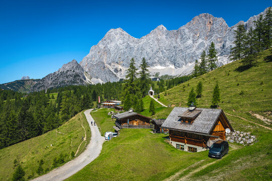 Alpine chalets on the green slopes, Ramsau am Dachstein, Austria