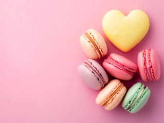 Fototapeta premium Top view of sweet macaron in heart shape with copy space on pink background, love and valentines day concept