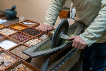 Traditional Chinese Medicine is grinding aromatherapy herbs