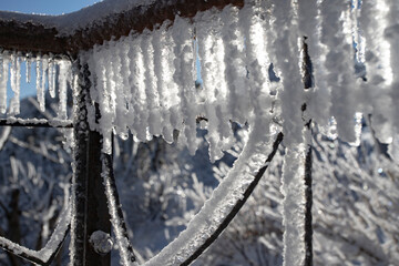icicles and Snow on the old balcony railing
