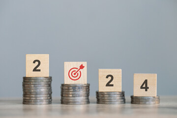 wood cube block with Investment returns in 2024 grow as targeted