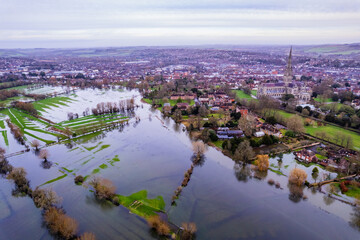 Aerial shot of flooded fields and burst river Avon near to Salisbury cathedral, Wiltshire, UK