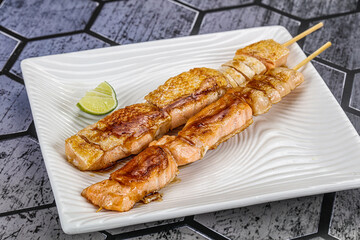 Grilled salmon skewer with sauce