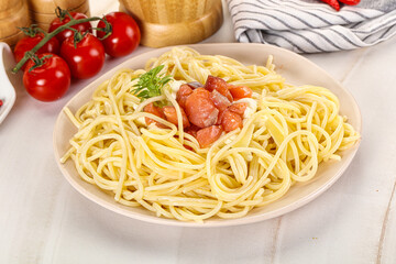 Pasta spaghetti with salmon and stracciatella