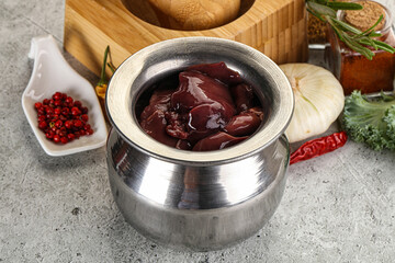 Raw uncooked chicken liver in the bowl