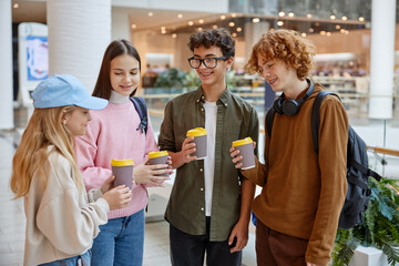 Group of children drinking coffee sharing emotion during shopping time