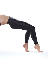 A fitness instructor demonstrates the starting position of the yoga bridge pose
