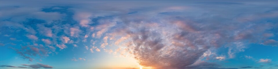 Bright sunset sky panorama with glowing red pink Cumulus clouds. HDR 360 seamless spherical...