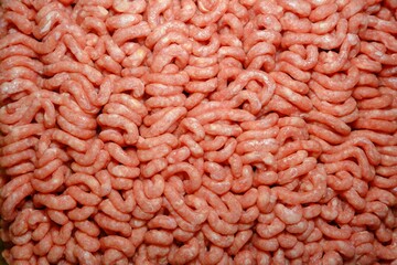 Fresh ground beef on a dark background. Close-up of minced meat