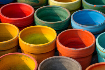 Organizing garden pots, colorful, orderly, sunny. 