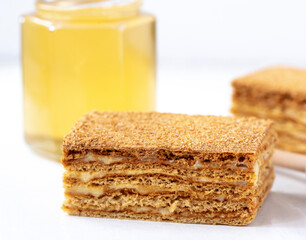 Honey layered cake or russian cake Medovik on white background. Close up view