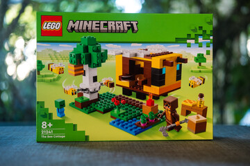 Fototapeta premium Bangkok, Thailand - January 7, 2024 : A box of LEGO Minecraft The Bee Cottage number of 21241. Action-packed set featuring Minecraft iconic bees. Lego is a popular line of construction