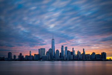 Morning atmosphere with colorful sky above Lower Manhattan cityscape. New York panorama as captured from New Jersey. - obrazy, fototapety, plakaty