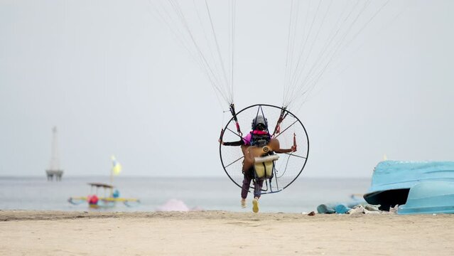 Paramotor pilot ascents into open skies, adventure, freedom, and dream pursuit
