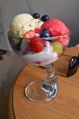 A cup with ice cream and fruit