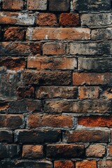Naklejka premium A picture of a red brick wall with a white sign. This versatile image can be used for various purposes