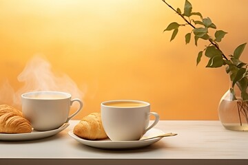 Morning coffee and croissant on table with neutral yellow background - french breakfast