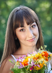 Naklejka premium Beautiful young girl in summer park