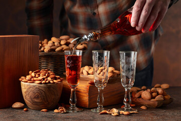 Italian liqueur Amaretto with almonds nuts.