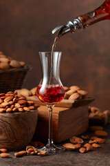 Italian liqueur Amaretto with almonds nuts.