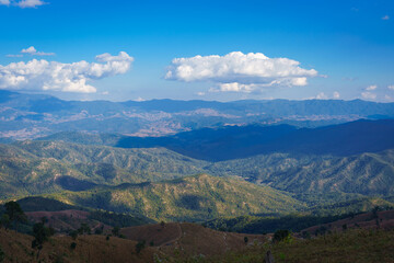 Beautiful scenery of the sea of mist in the morning at Car Camping site with a viewpoint is fresh nature of Doi Balu Kho Mountain, Mae Chaem, Chiang Mai, Northern Thailand. Background concept.