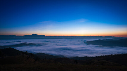 Beautiful panorama scenery of the sea of mist in the morning at Car Camping site with a viewpoint nature of Doi Balu Kho Mountain, Mae Chaem, Chiang Mai, Thailand. Background concept.