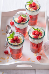 Homemade red jelly made of whipped cream and berries.