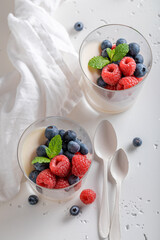 Tasty and homemade Panna Cotta made of milk and berries.