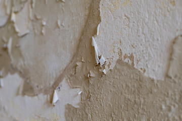 old wall with torn off wallpaper