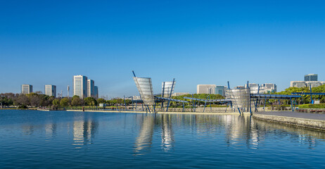 Naklejka premium Scenic bridge in a park in Wuxi, China on a sunny day