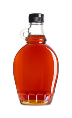 Maple syrup in a glass bottle. Bottled Canadian maple syrup made from the sap of maple trees in...