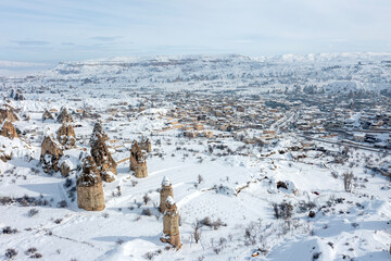 Pigeon Valley and Cave town in Göreme in winter, Fairy chimneys, Cappadocia, Turkey.