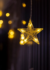 transparent stars with yellow diode lamps on a dark background, New Year and Christmas theme