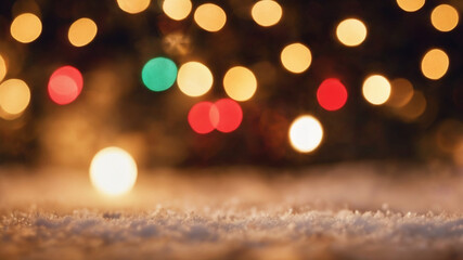 Fototapeta na wymiar snowfall focused with christmas blurry lights background