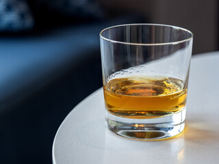 Beautiful glass with glass with an alcoholic drink standing on a table. Top view, close-up....