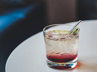 Beautiful glass with a refresh cocktail, standing on a table. Top view, close-up. Vacation and travel concept. Moments of celebration