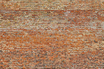 red brick structure on a large wall