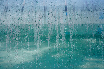 Condensation water running down on glass  