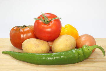 vegetables on a board on white background